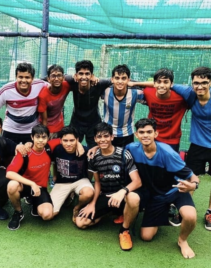 Pratham playing soccer with friends